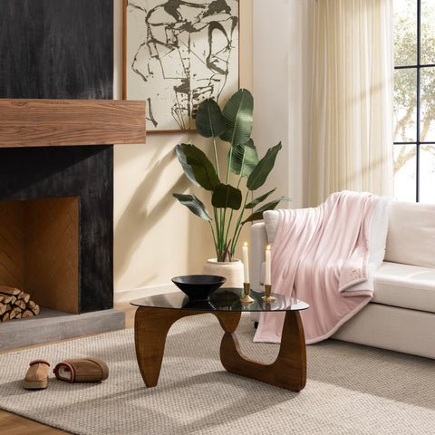 UGG Bliss Throw Blanket light pink fleece side adds soft warmth to seating areas.