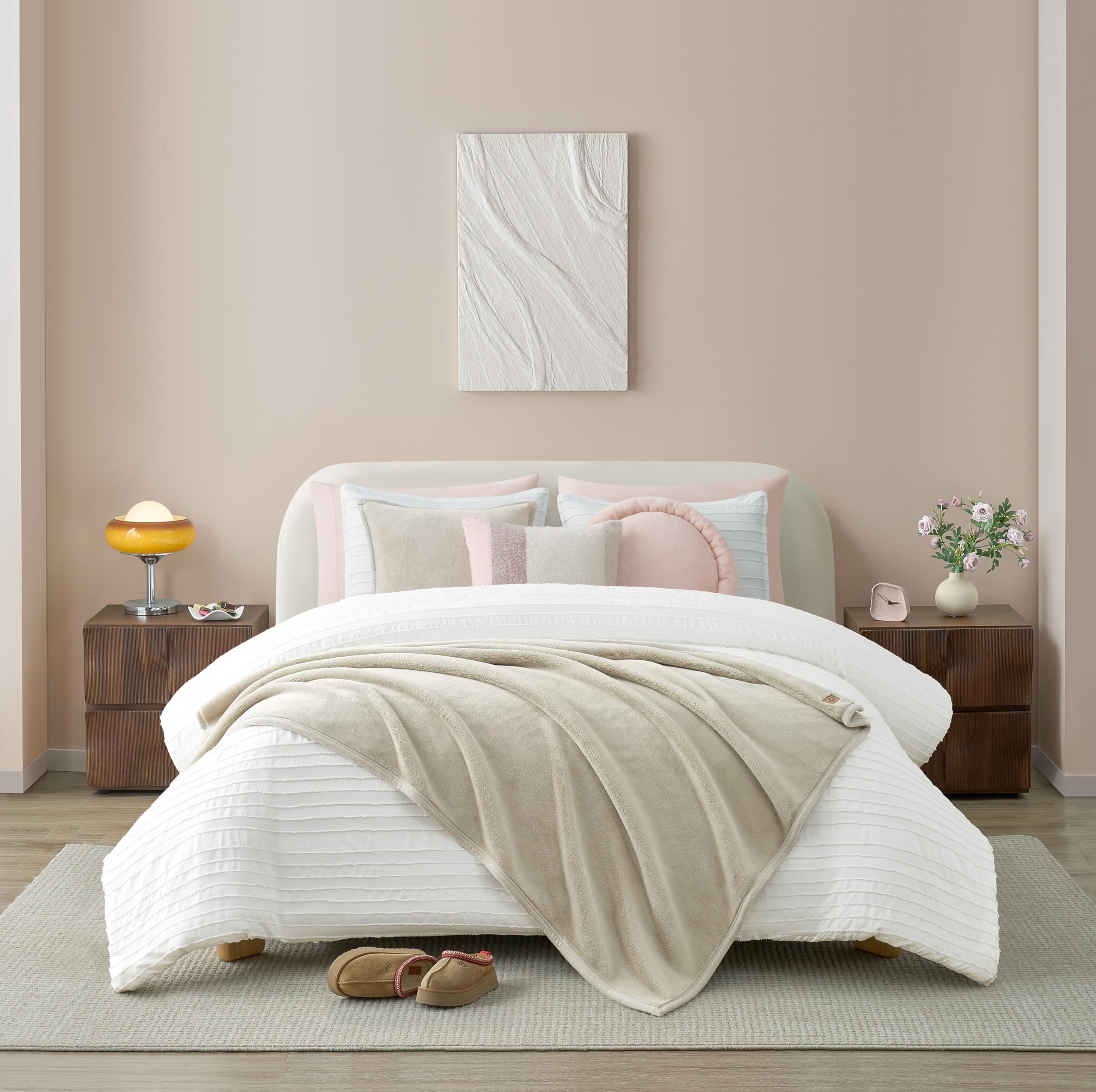 UGG Coco Plush Blanket on sofa, creates cozy living room ambiance