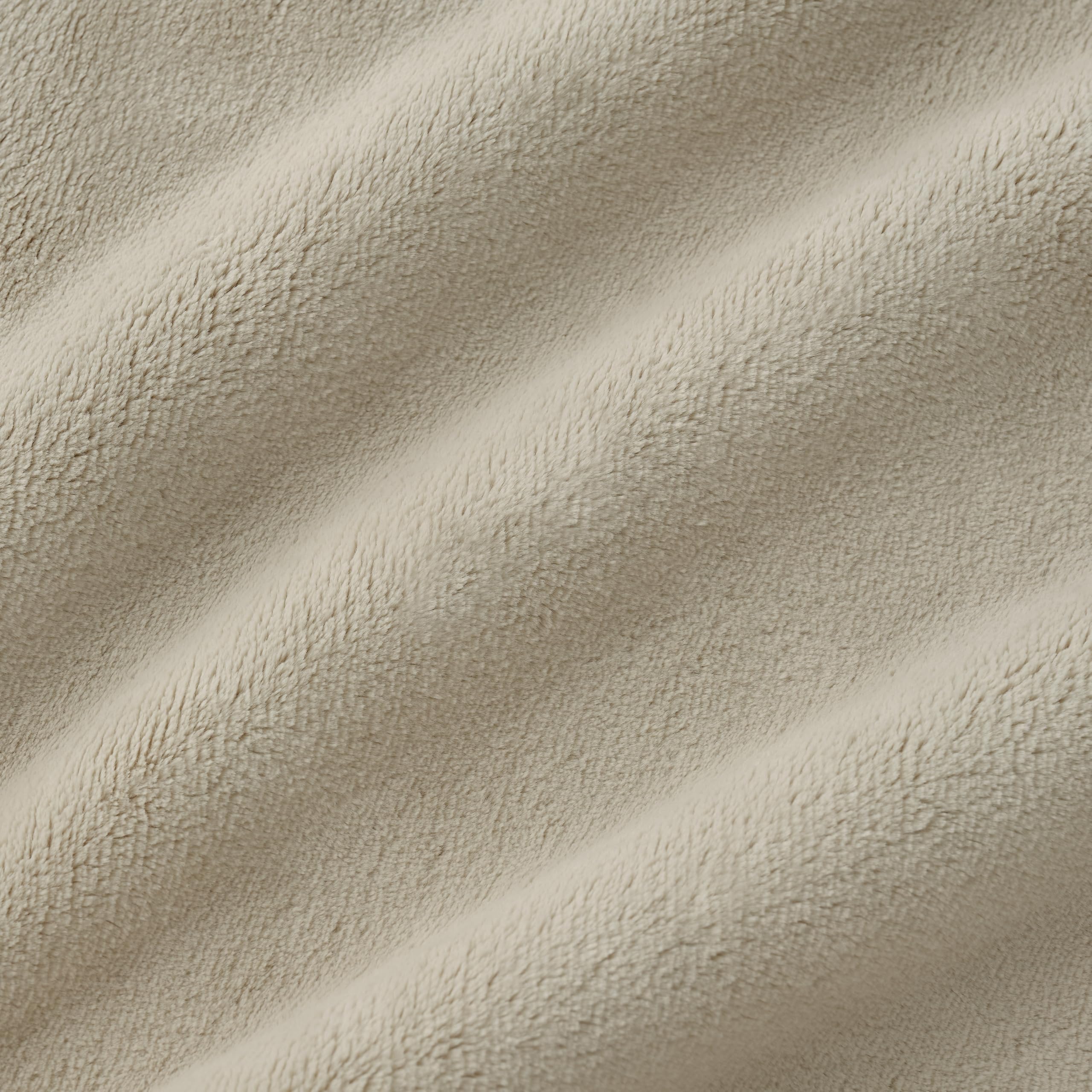 UGG Coco Plush Blanket in a styled room, adds decor depth