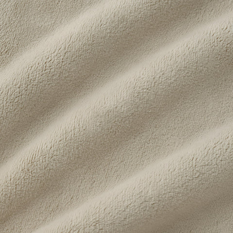 UGG Coco Plush Blanket in a styled room, adds decor depth