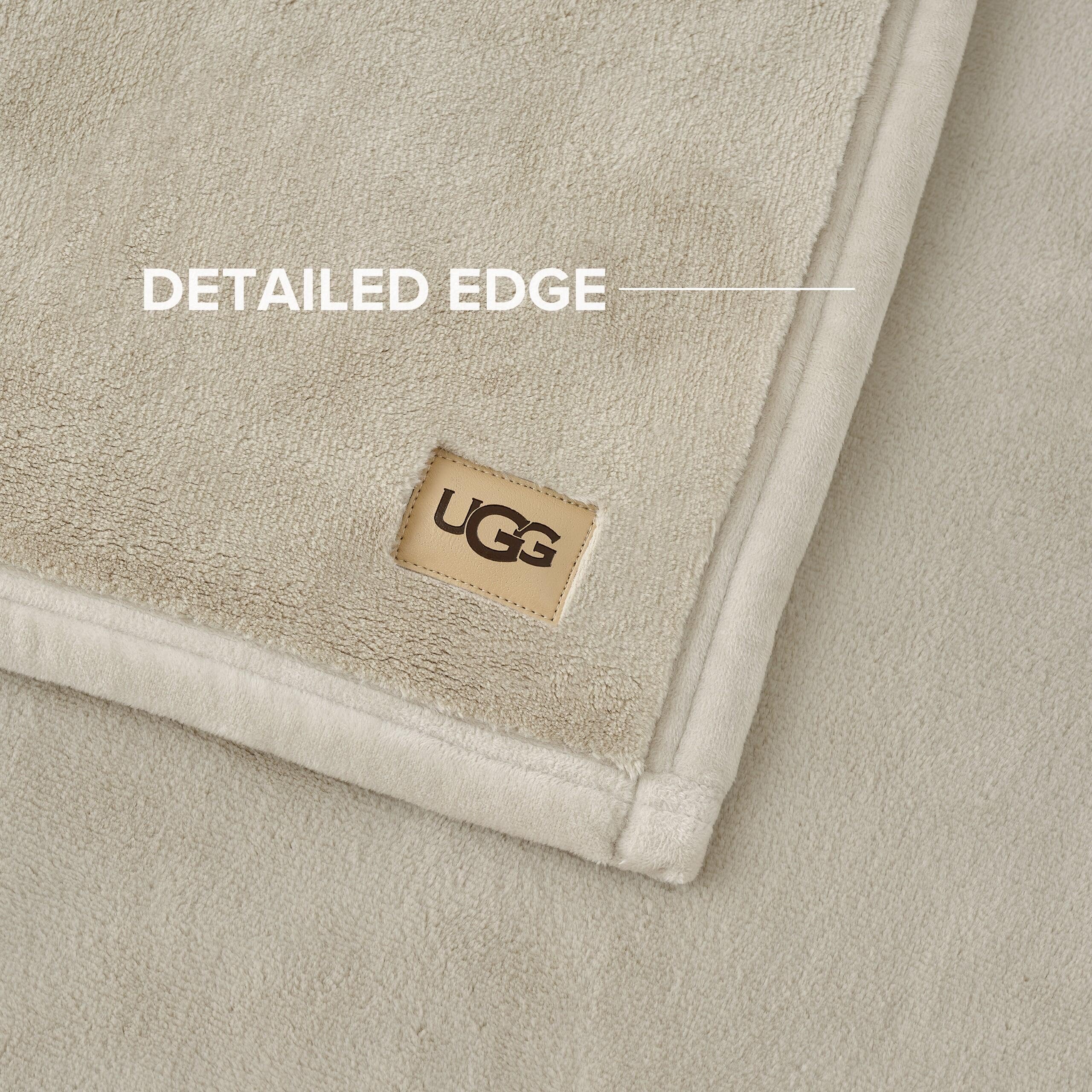 UGG Coco Plush Blanket draped over chair, ideal for reading
