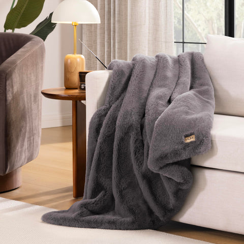 UGG Euphoria throw plush fur front with soft backing for cozy nights.