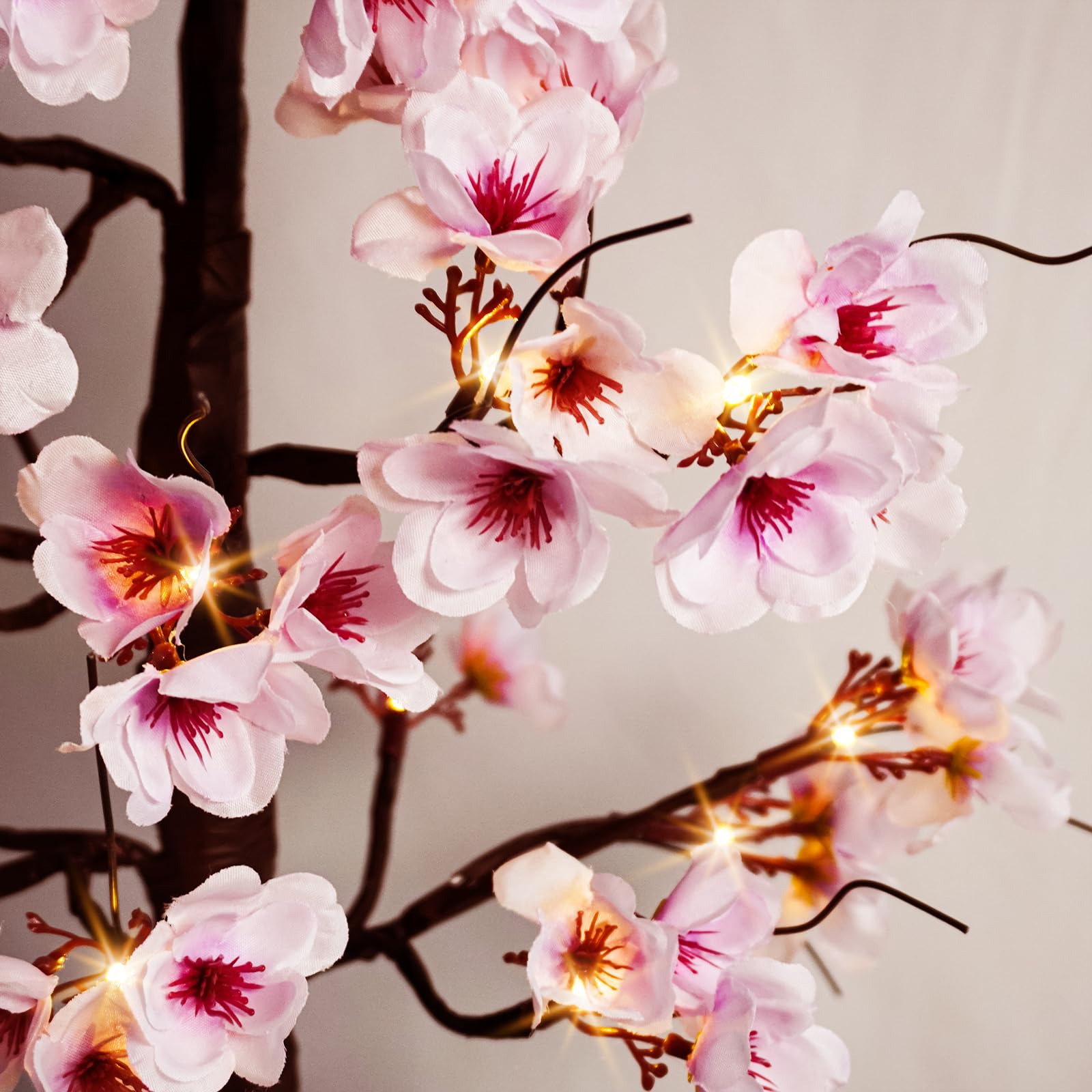 Uieke Cherry Blossom Tree supports indoor-outdoor use with versatile setup options.