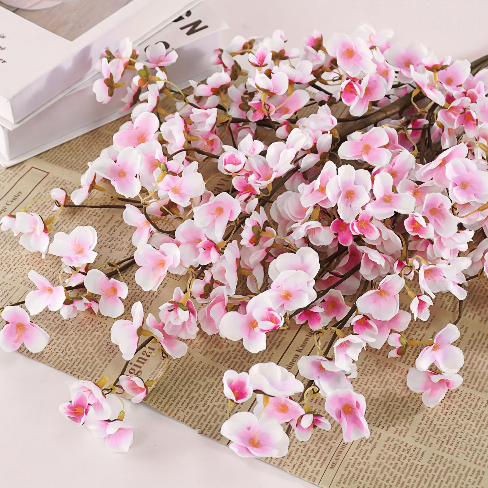 Close-up of Uieke pink silk cherry blossom petals for lifelike detail.
