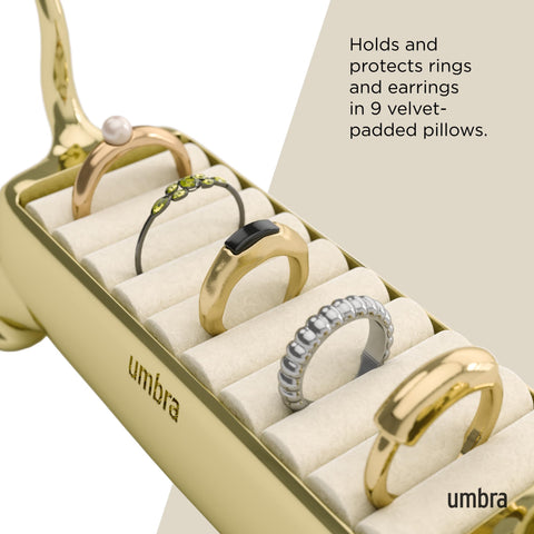 Umbra Ali Cat ring holder displayed on nightstand for quick access.