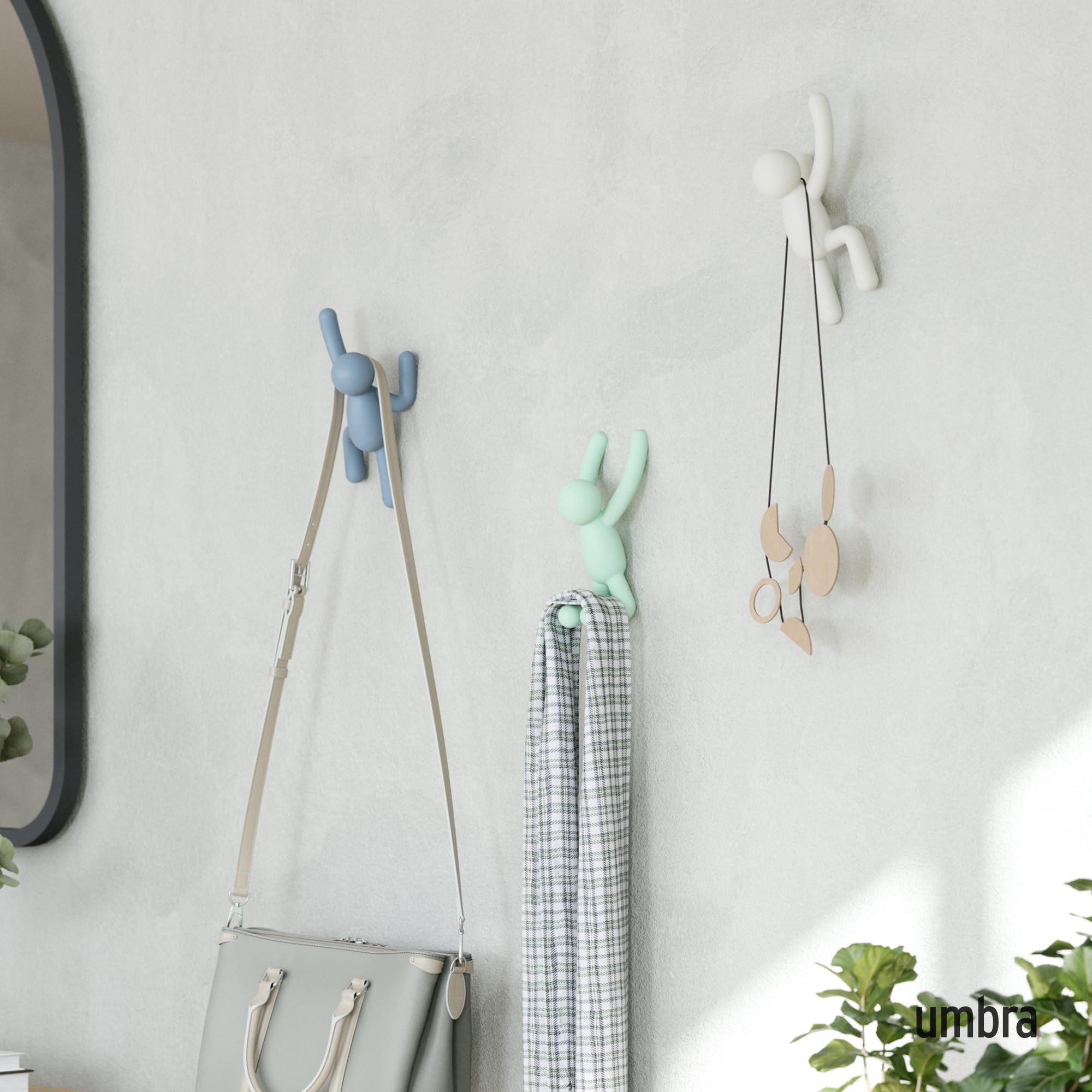 Close view of Buddy arms acting as coat hangers on a wall.