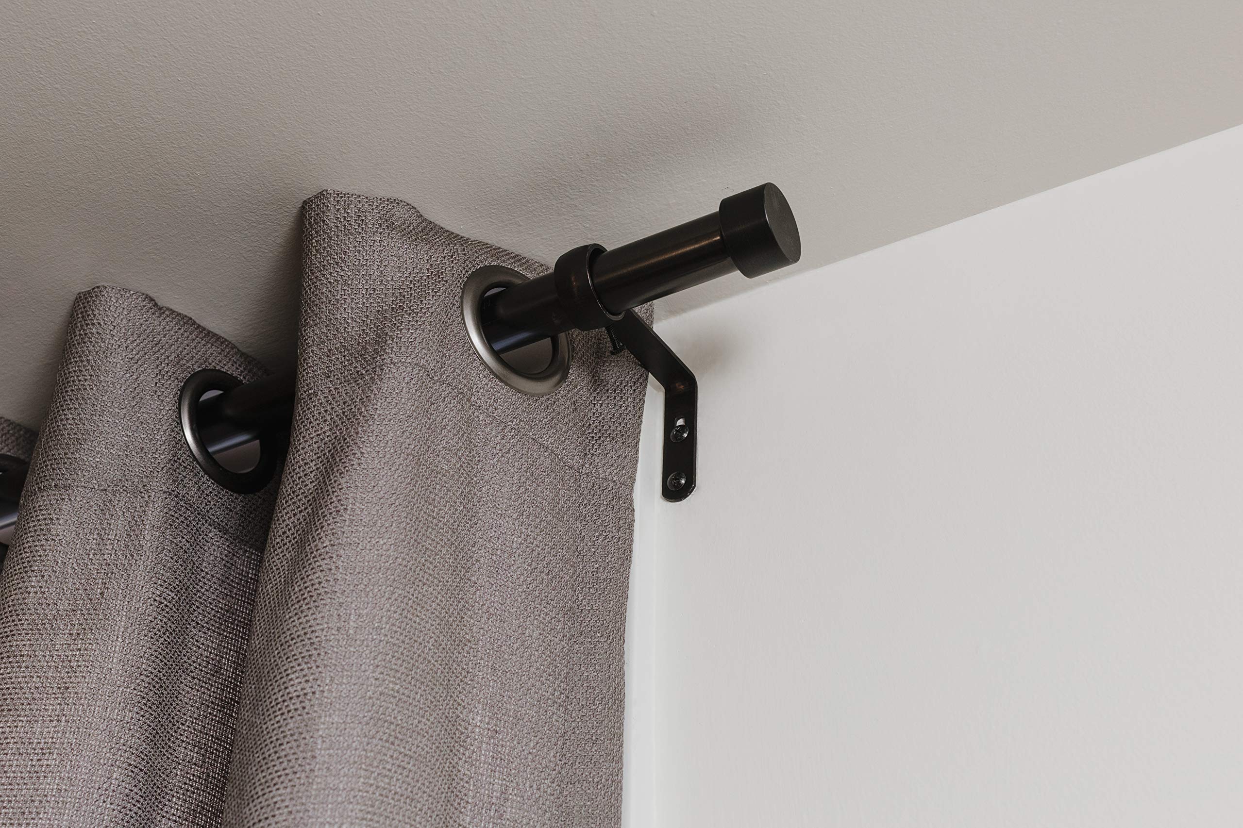 Umbra Cappa supports curtains up to 22 pounds for versatile styling.