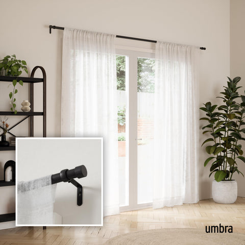 Umbra Cappa metal finials add a clean, modern accent to window treatments.