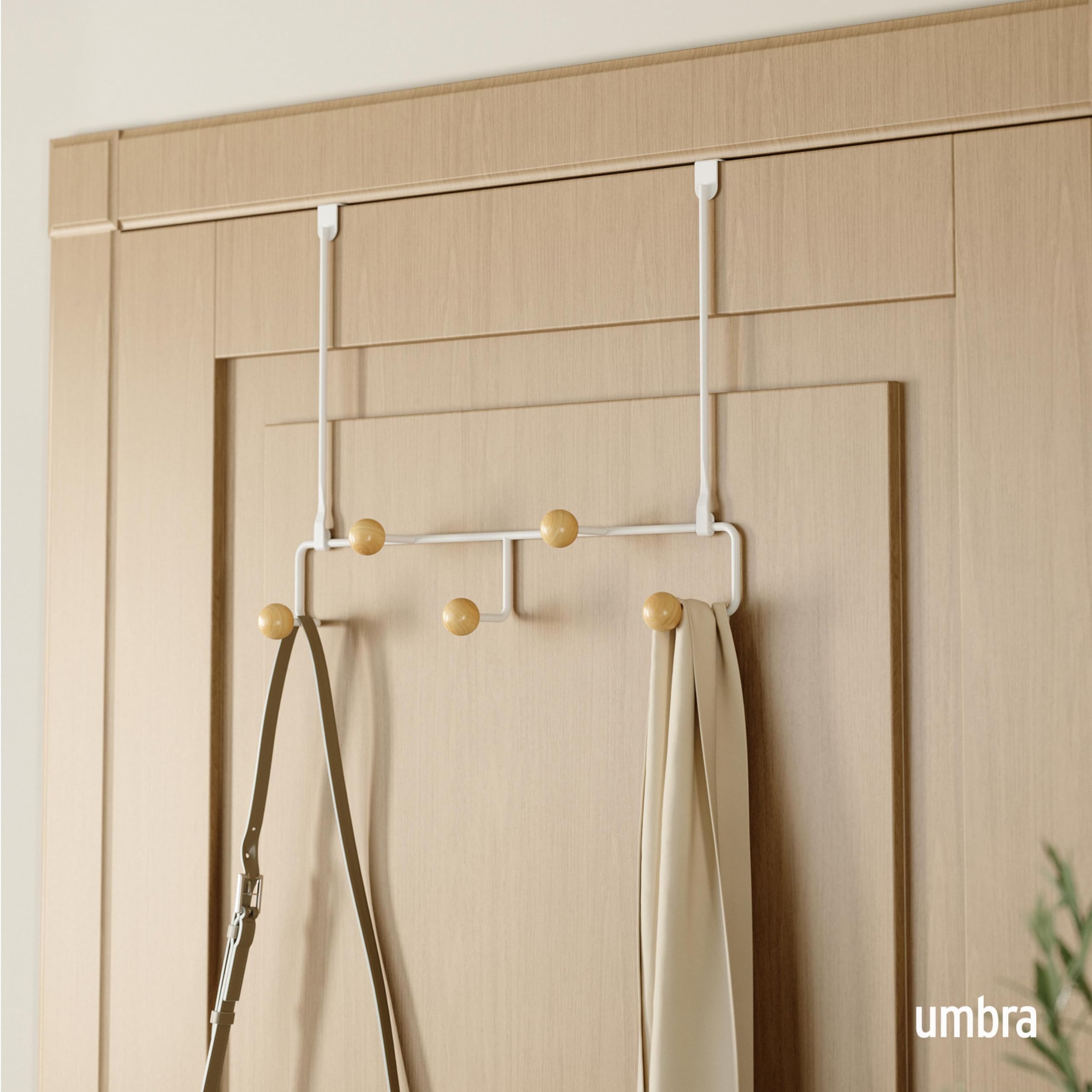 Umbra Estique wooden knob hooks close-up showing snag-free design.