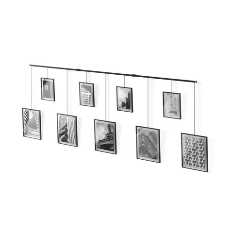 Umbra Exhibit wall-mounted ledge with nine frames for flexible gallery display
