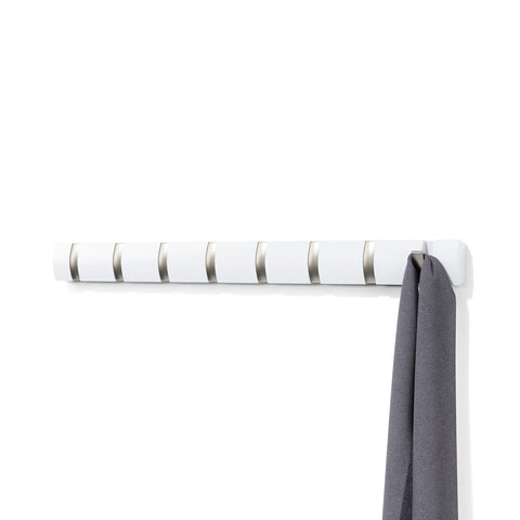 Umbra Flip 8-hook wall-mount coat rack in white-nickel for space-saving entryways.