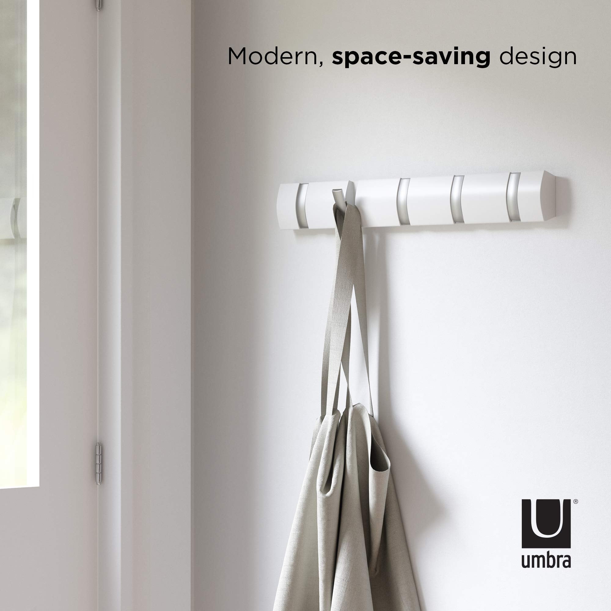 Umbra Flip bathroom setup holds towels with a clean look.