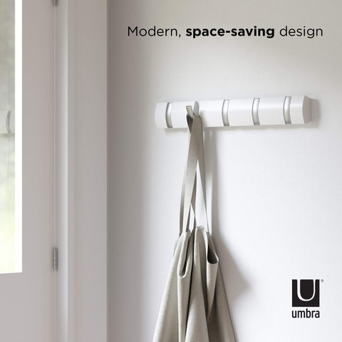 Umbra Flip bathroom setup holds towels with a clean look.