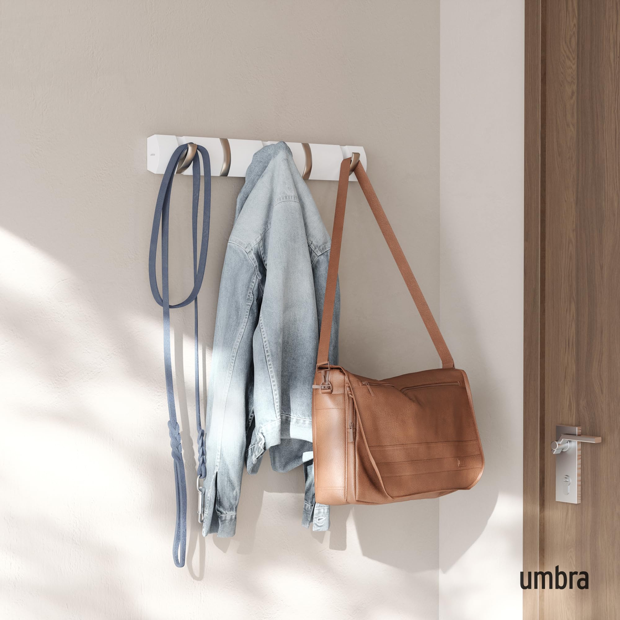 Umbra Flip retractable hooks close up, showing space-saving design for small entryways.