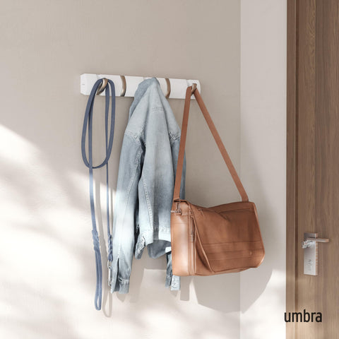 Umbra Flip retractable hooks close up, showing space-saving design for small entryways.