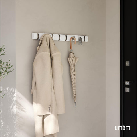 Umbra Flip hooks extended to hang coats, scarves, and bags.