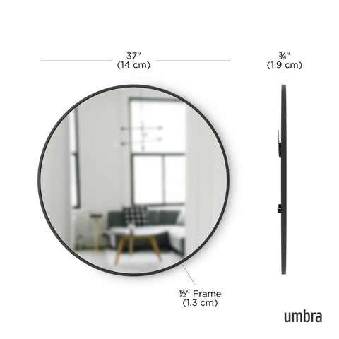 Umbra Hub round mirror reflects light to brighten small spaces in black