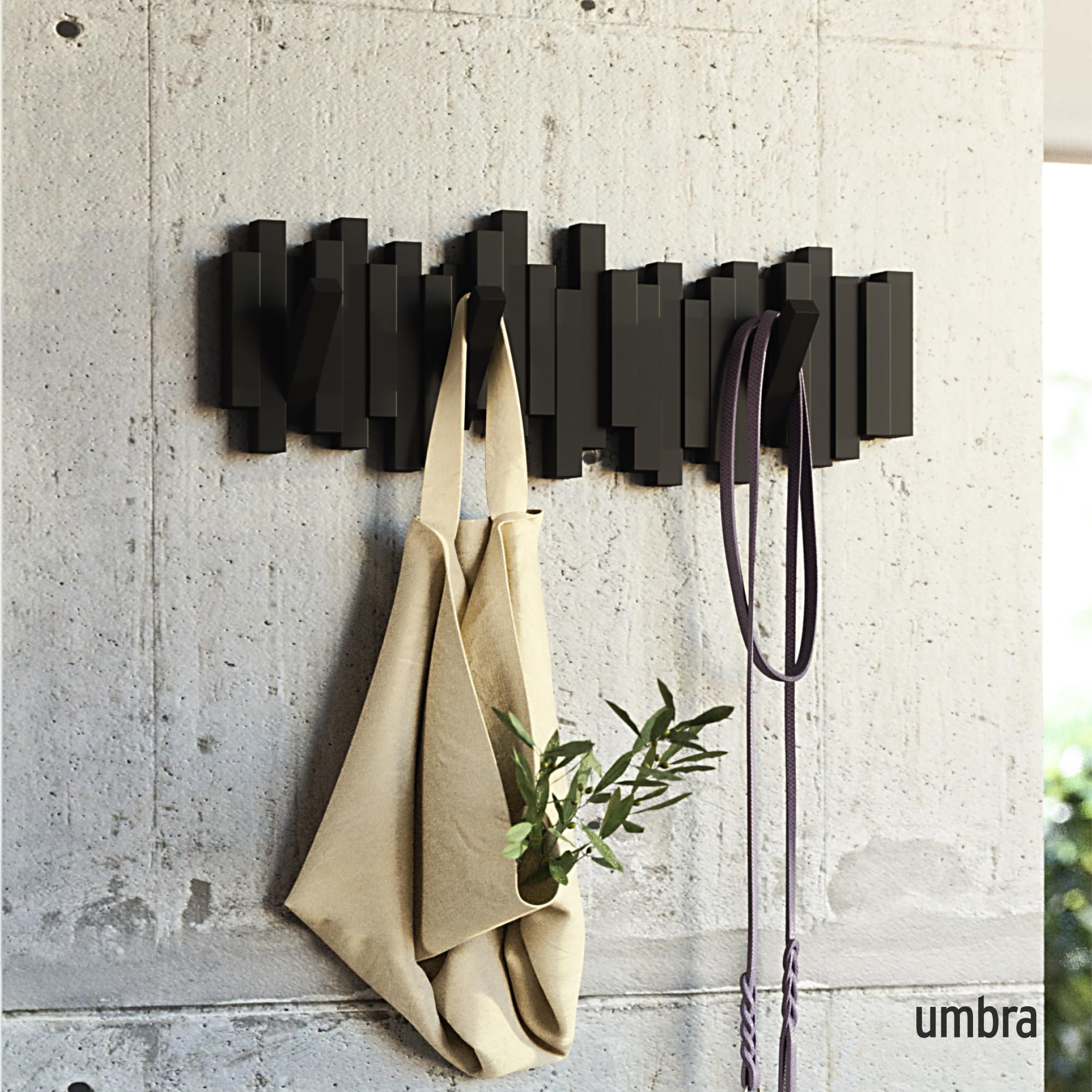Umbra Sticks close-up of retractable hooks showing hidden functionality.