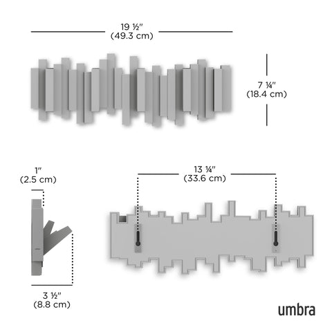 Umbra Sticks flip-down coat hooks in action for quick access to outerwear.