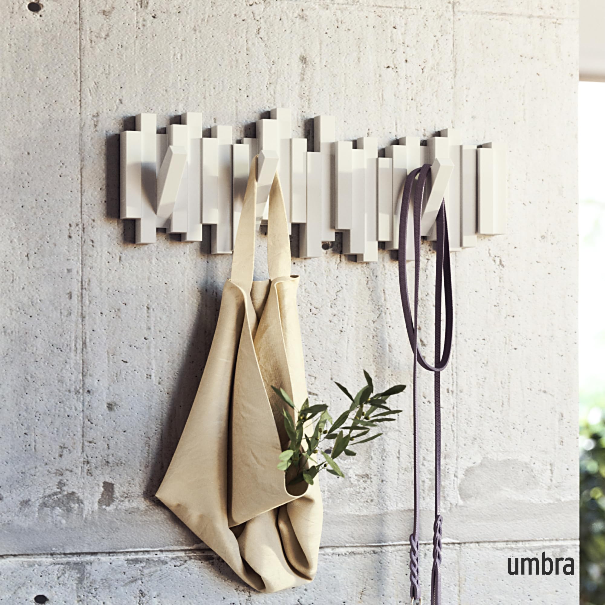 Umbra Sticks flip-down pegs in action provide quick-access hanging.