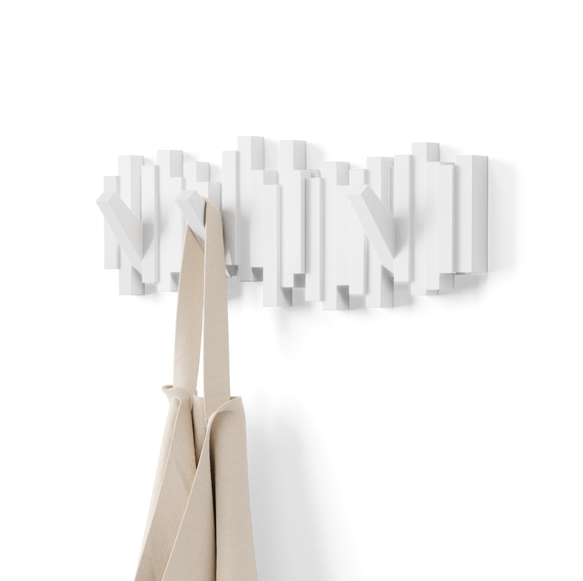 Umbra Sticks wall-mounted coat rack white offers organized hanging space.