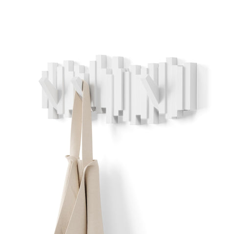 Umbra Sticks wall-mounted coat rack white offers organized hanging space.