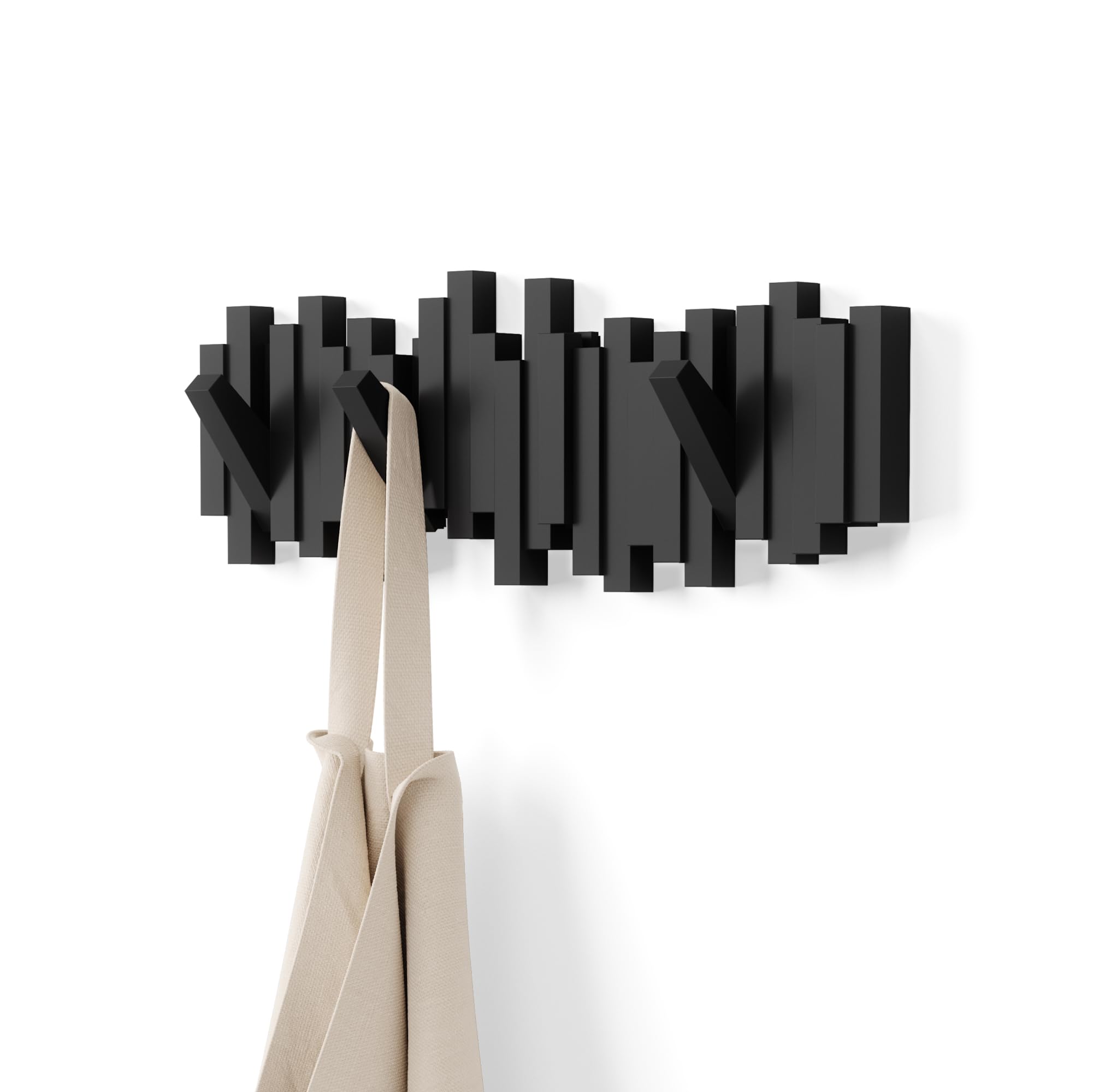 Umbra Sticks wall-mounted coat rack with five retractable hooks for compact entryways.
