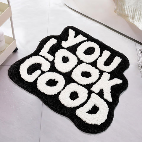 UNIBATH You Look Good Bath Mat in black and white, stylish 25x21 rug for baths.