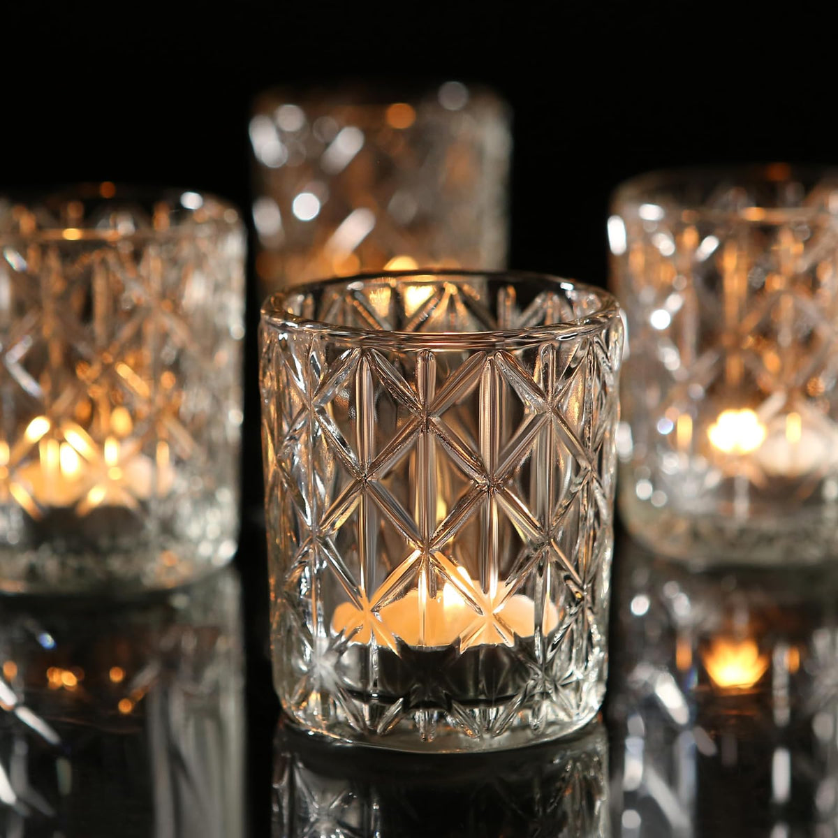 Uniteland 36-pack votive holders in clear glass enhance ambient lighting for table settings.