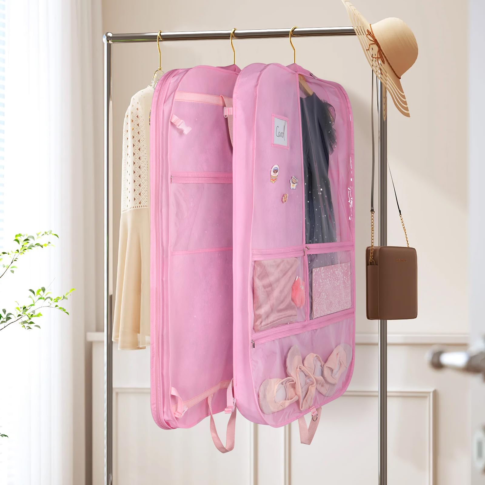 Univivi pink garment bag handles folded for easy carrying
