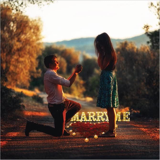 Upper Midland 'Marry Me' letters light up to spotlight the proposal.