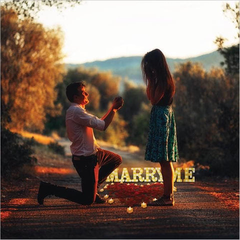 Upper Midland 'Marry Me' letters light up to spotlight the proposal.