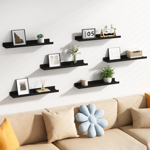 Upsimples display shelves for plants, photos, and books keep items organized.