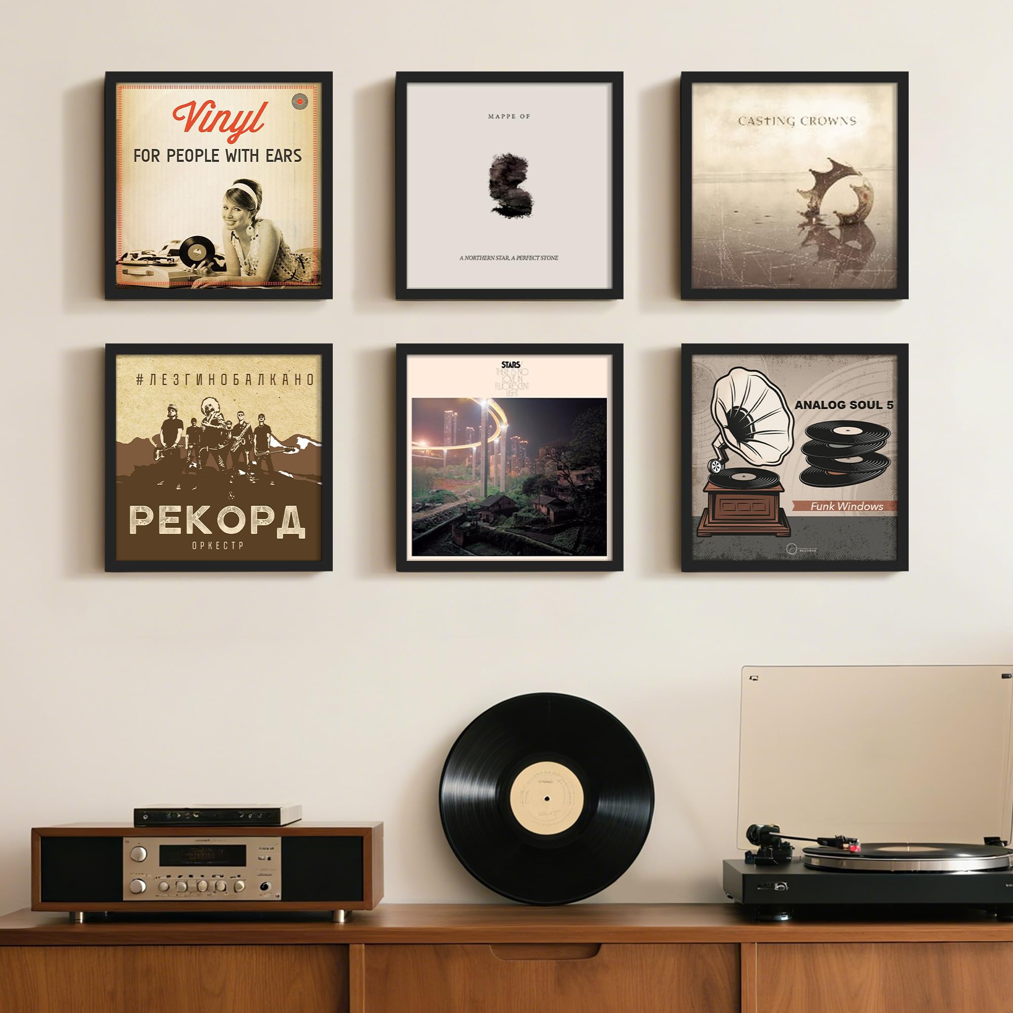 upsimples room display setup with vinyl frames and art