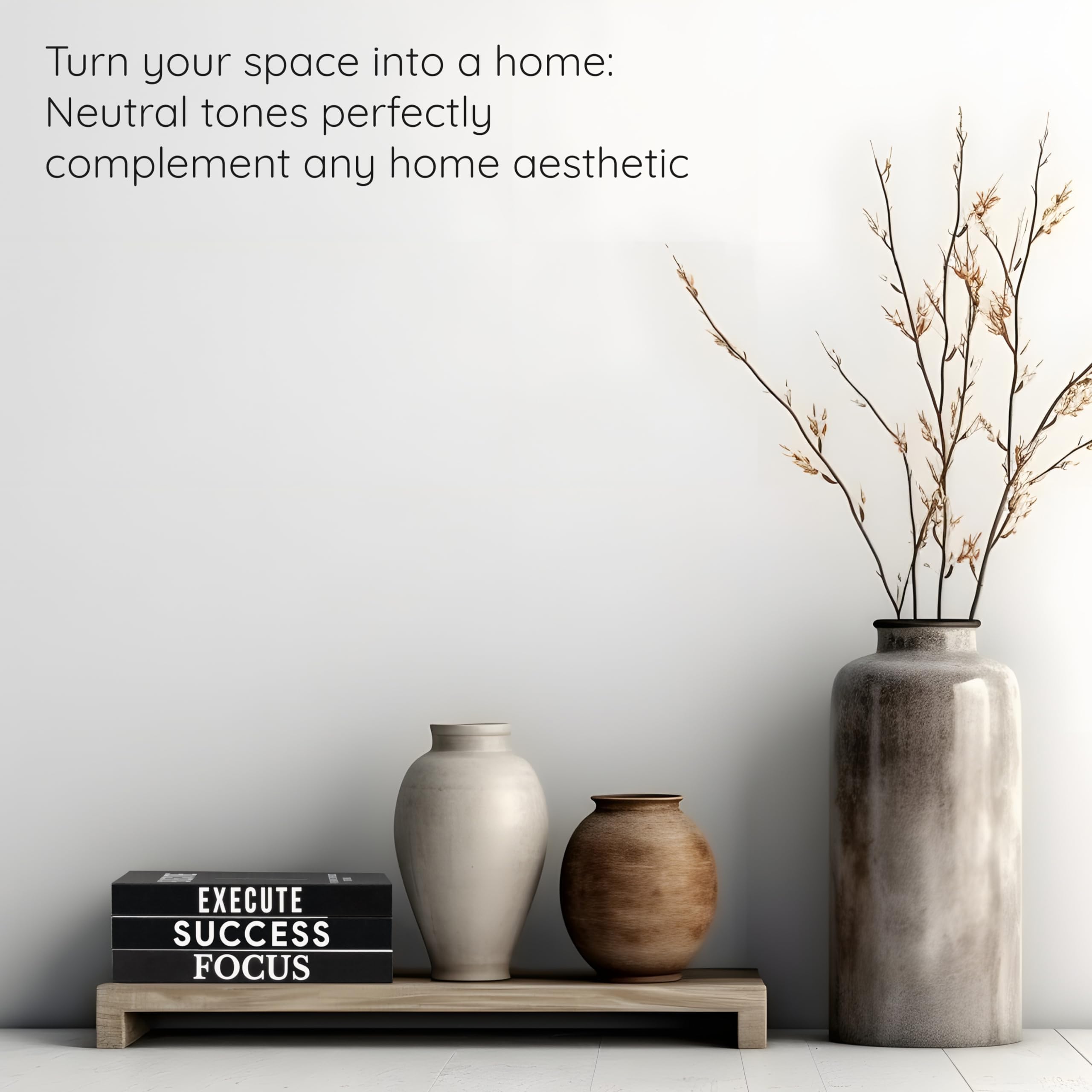 Upstart Decor books on a coffee table create a chic display.