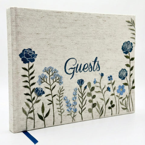 Upstart Decor linen embroidered photo guest book cover adds elegant charm for weddings.