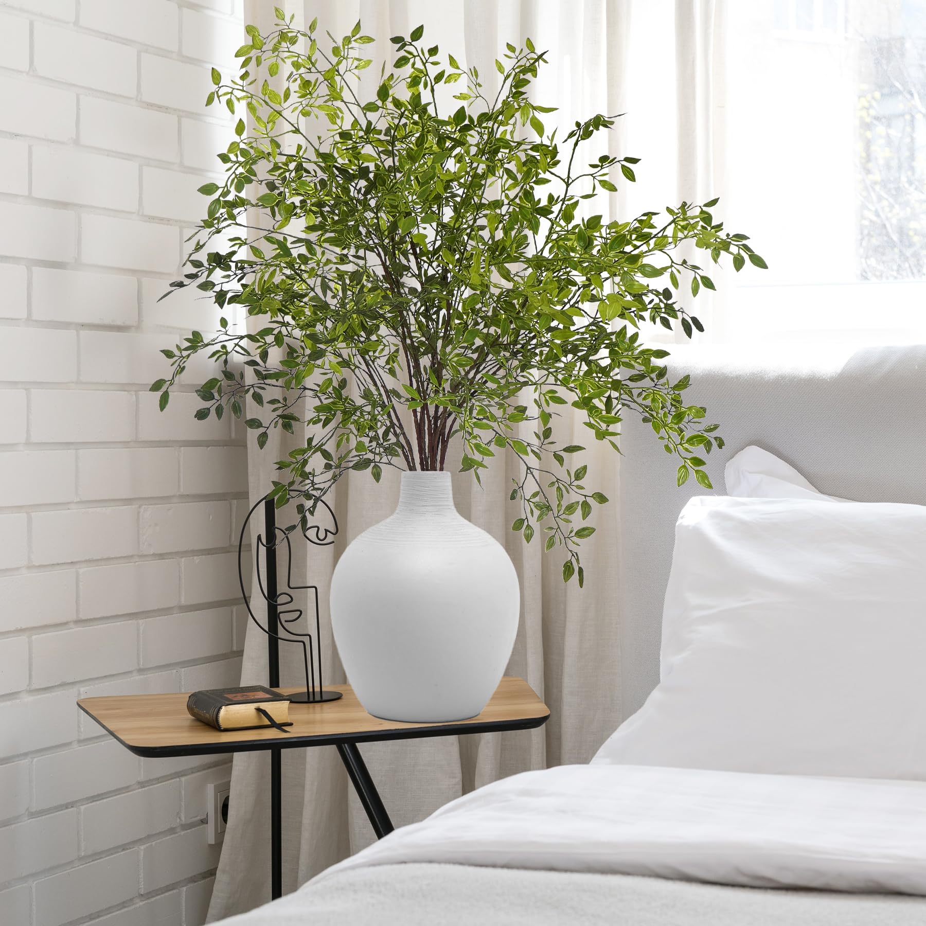 Uqueeten floor-vase stems offer height and drama for tall displays