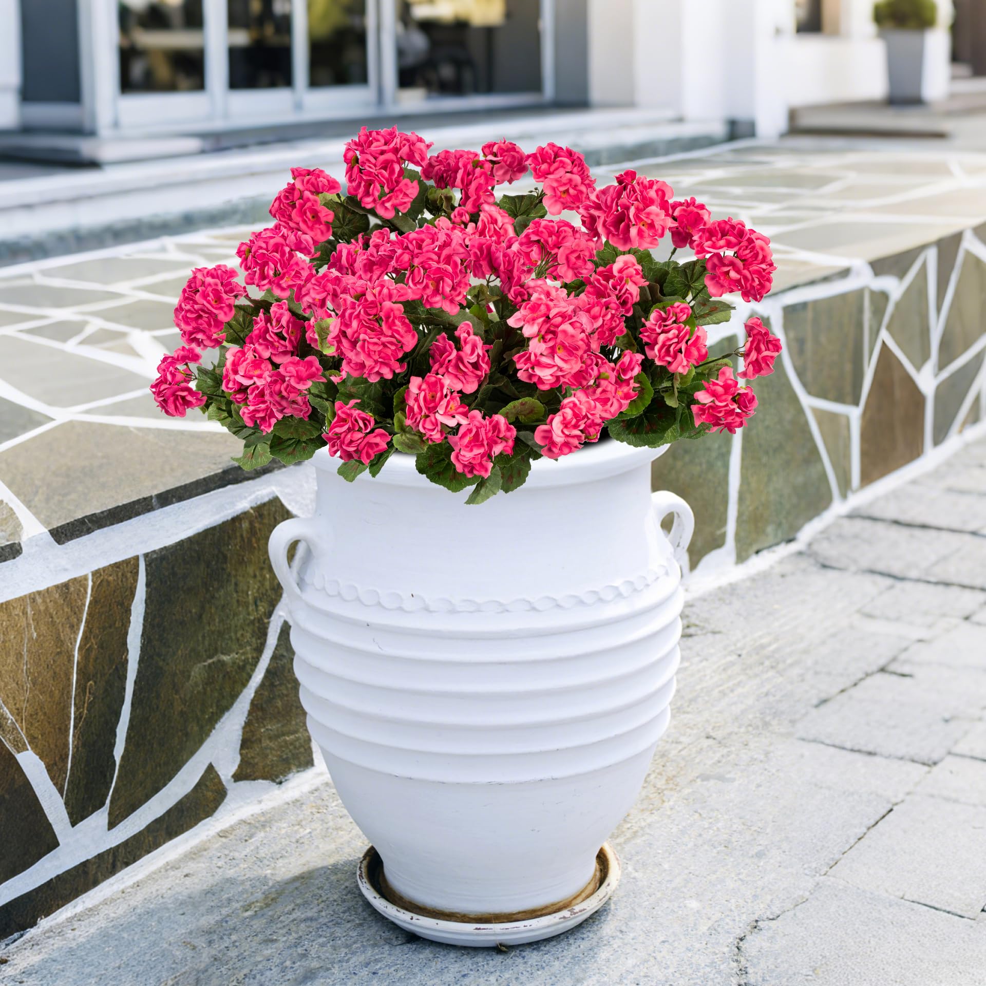 Uqueeten outdoor flower decor on porch brightens entryways.