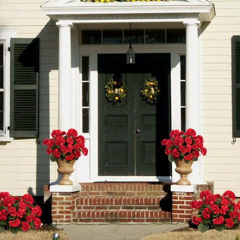 Uqueeten outdoor porch and garden decor using red geraniums for curb appeal.