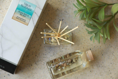 Urban Naturals glass bottle and reeds close-up showing long-lasting fragrance diffusion