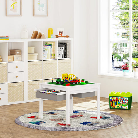 UTEX wooden play table with storage drawers keeps blocks organized and accessible.