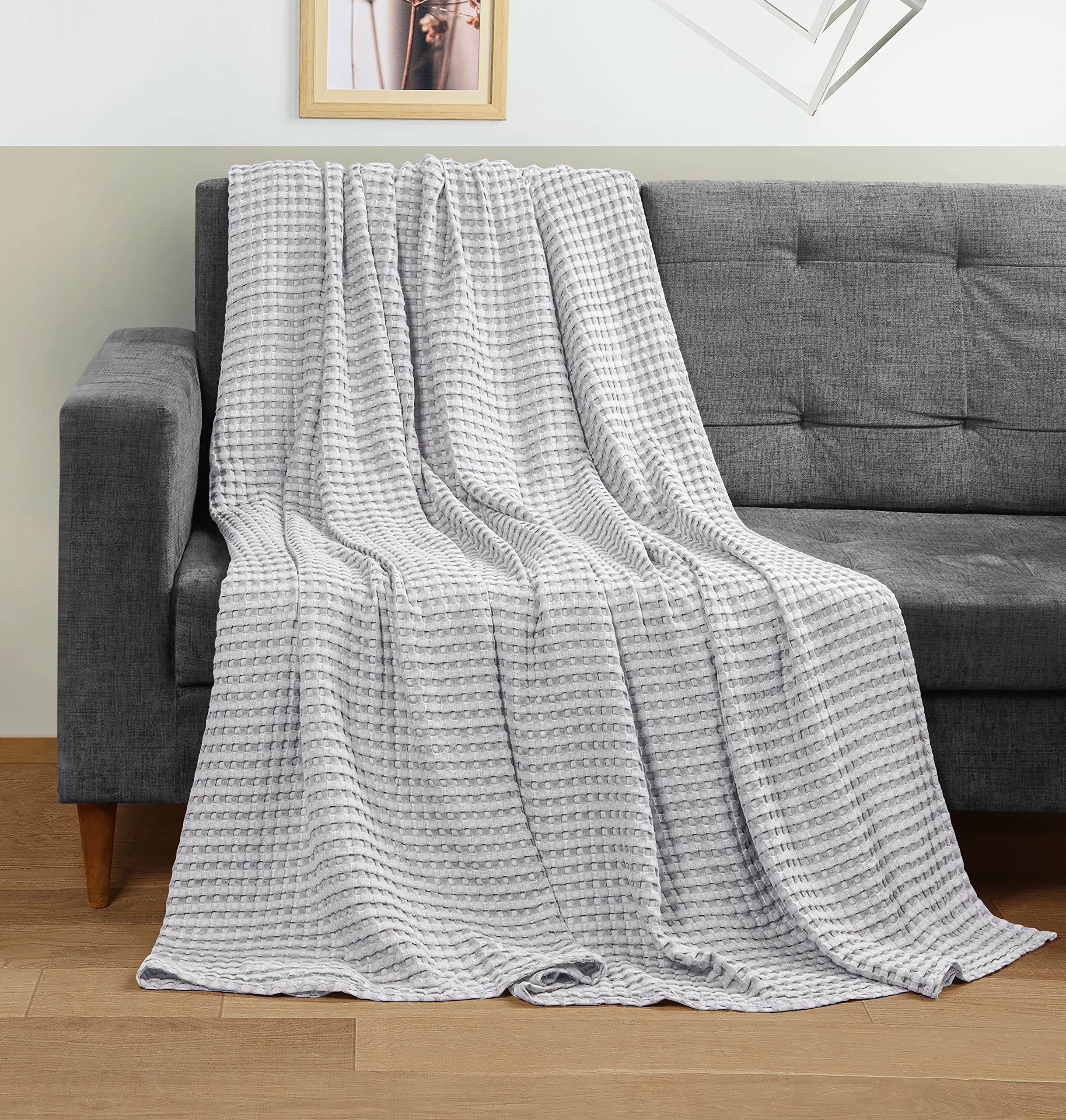 All-season blanket on bed showing versatile warmth and light weight.