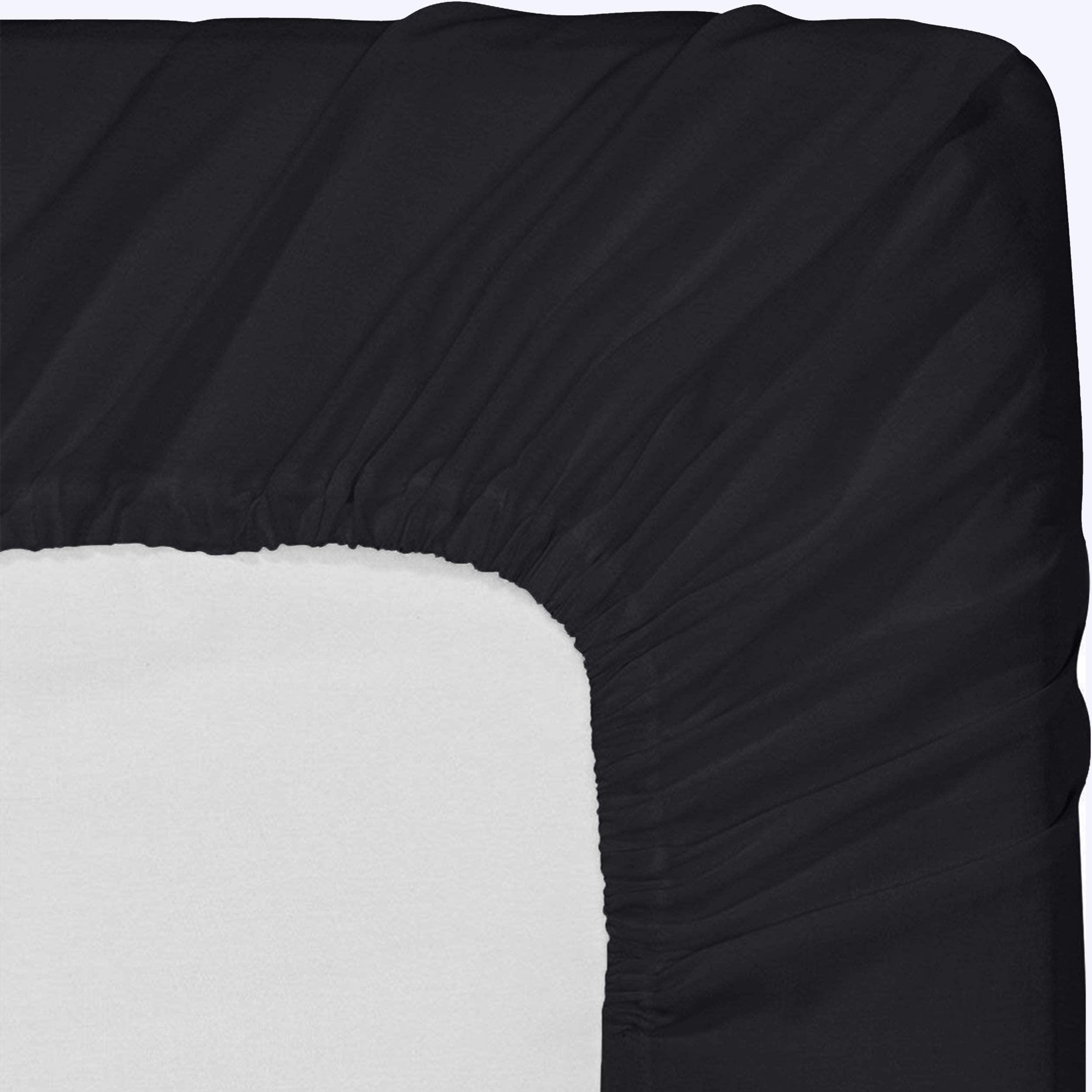 Utopia Bedding bed with black sheets looks tidy and inviting.