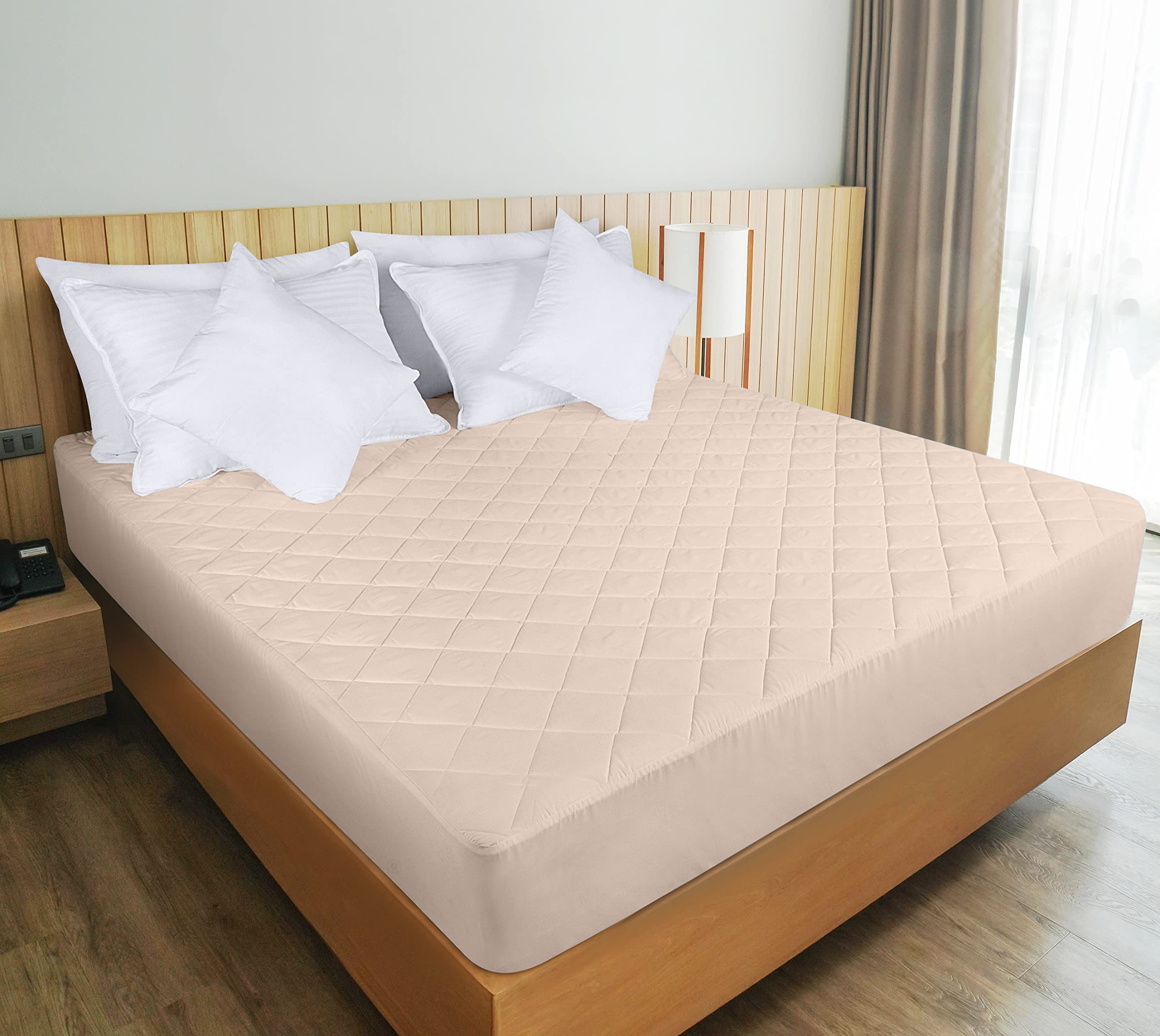 Breathable microfiber loft on Utopia Bedding quilted pad for comfortable sleep surface.