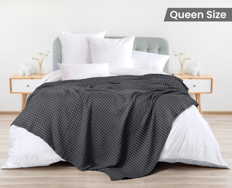Utopia Bedding charcoal waffle blanket draped on bed, airy and breathable