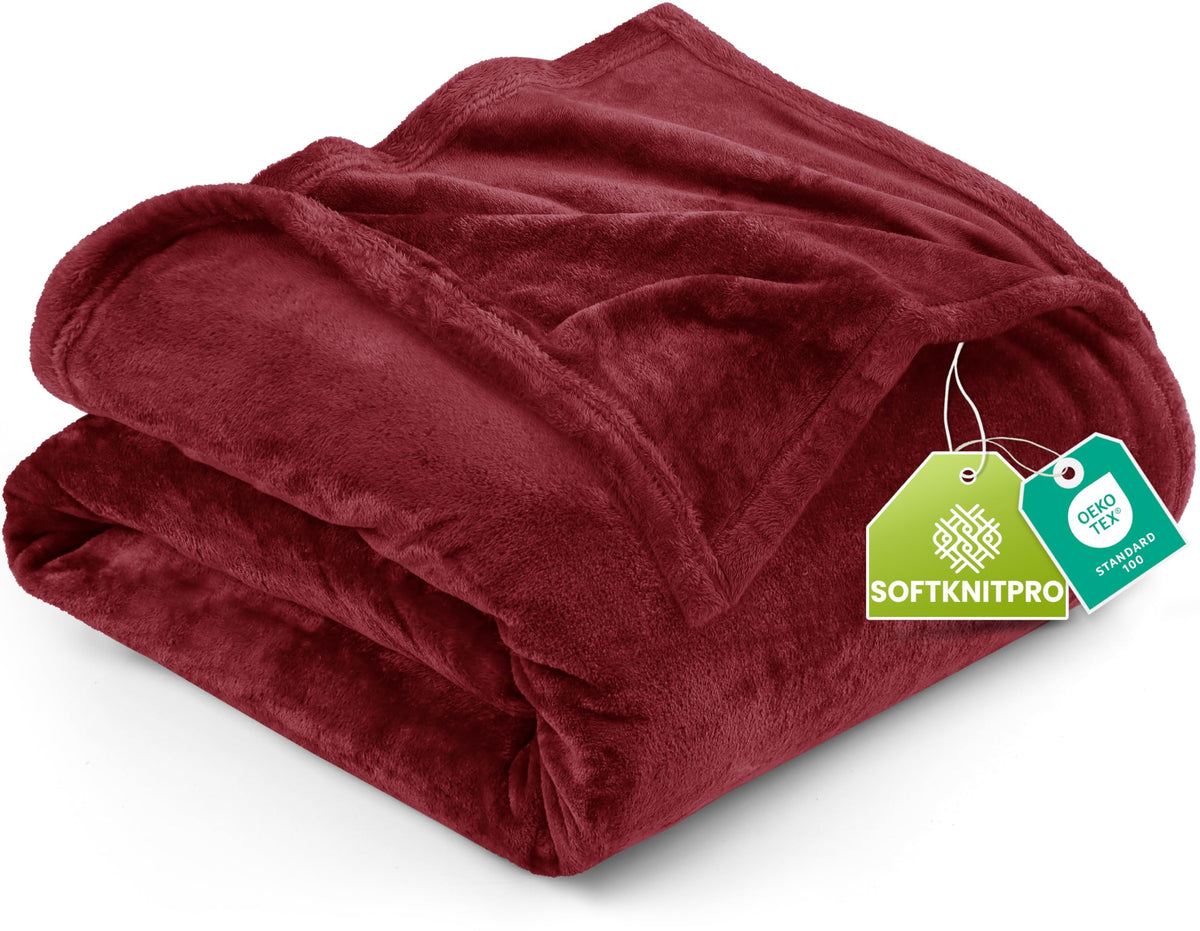 Utopia Bedding fleece blanket king burgundy 300GSM on bed for cozy warmth.