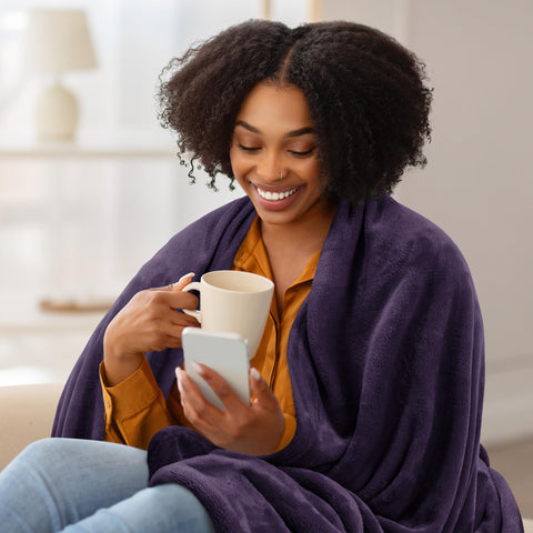 Utopia Bedding fleece blanket on living room couch for movie-night comfort