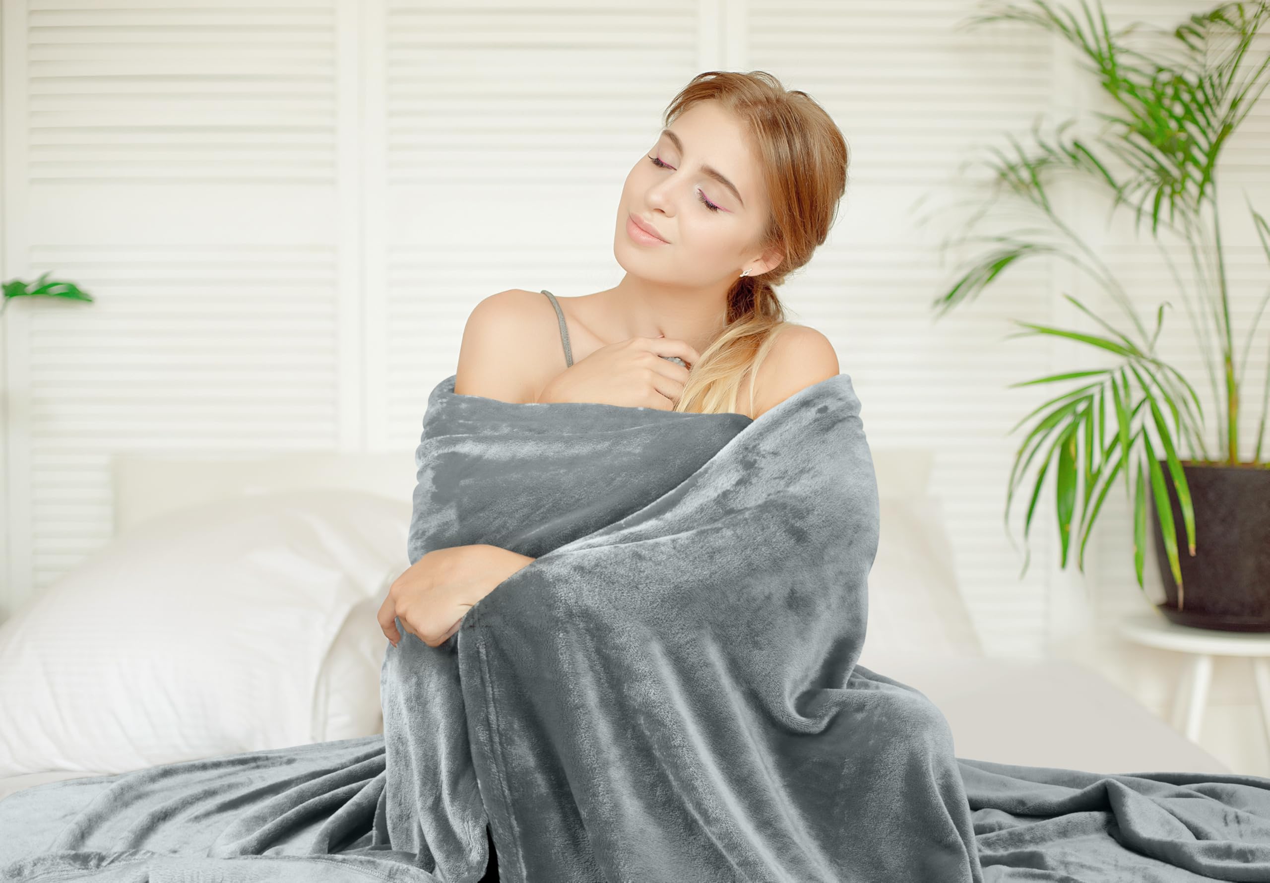 Utopia Bedding fleece blanket draped over sofa for movie night comfort.
