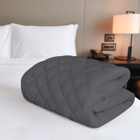 Utopia Bedding grey mattress pad laid on bed provides full coverage and breathability.