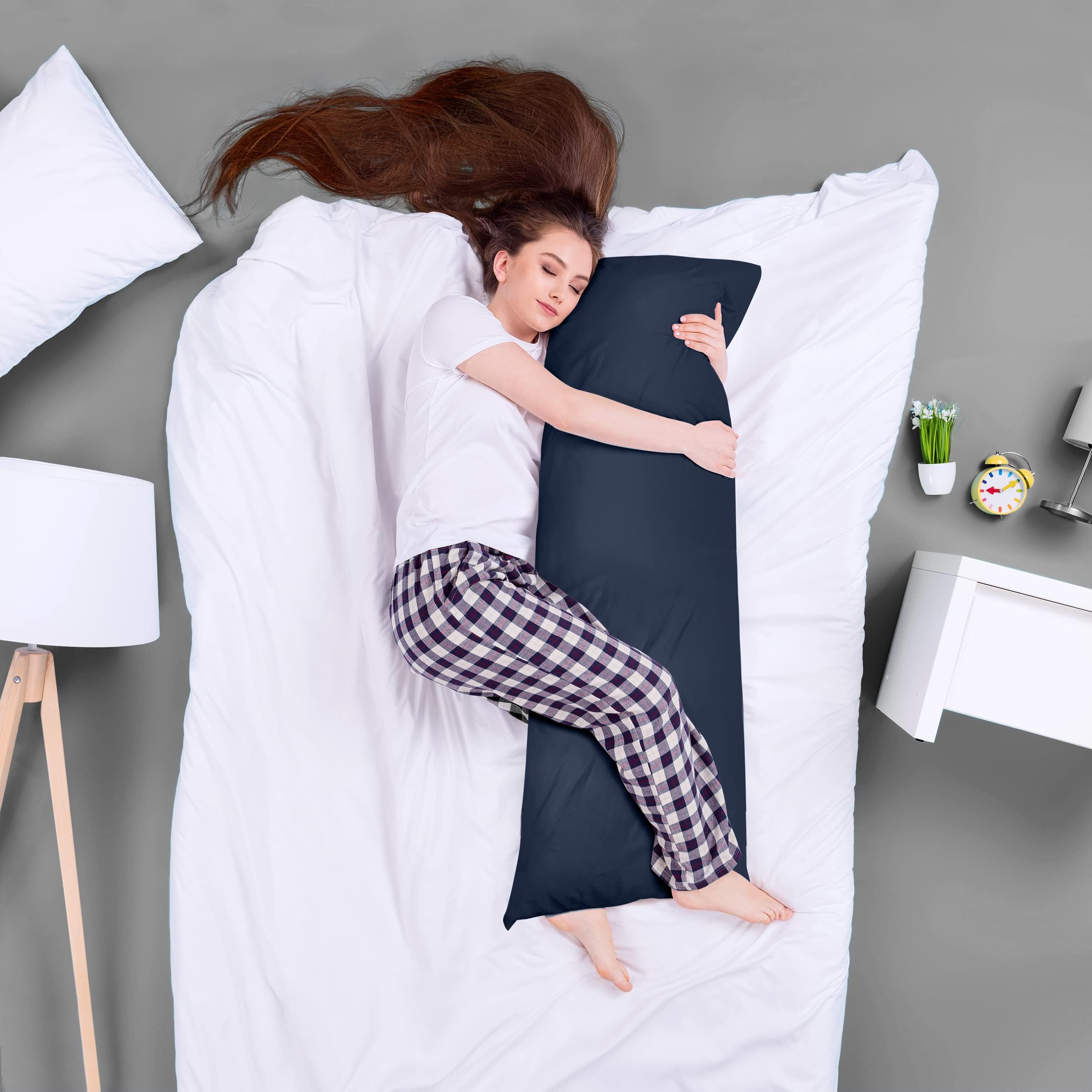 Utopia Bedding navy maternity pillow cradles hips and abdomen during rest.